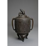 A JAPANESE BRONZE TRIPOD JAR AND COVER, MEIJI, 19TH CENTURY. Cylindrical form with twin animal