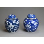 TWO CHINESE BLUE AND WHITE GINGER JARS AND COVERS, 19/20TH CENTURY. Each with typical prunus
