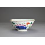 A CHINESE FAMILLE ROSE PORCELAIN BOWL, 19TH CENTURY. Decorated in vibrant enamels with prunus,
