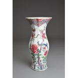 A CHINESE FAMILLE ROSE EXPORT PORCELAIN VASE, 18TH CENTURY. Lobed baluster form wide flared neck