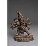 A NEPALESE BRONZE FIGURE OF SAMVARA AND CONSORT. The figure with four faces and ten arms embracing