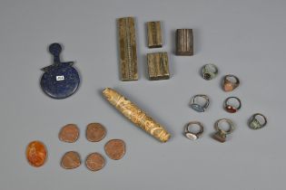 A MIXED GROUP OF STONE AND METALWARE ITEMS. To include four Indian bronze jewellery moulds or