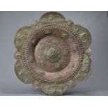 A LARGE INDIAN OR SOUTH EAST ASIAN BRASS AND COPPER CHARGER, EARLY 20TH CENTURY. Of radiating