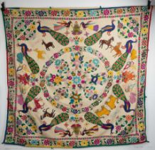 A VINTAGE INDIAN (GUJARATI) EMBROIDERED WALL HANGING. Decorated with rabbits, peacocks, horses,
