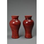 A PAIR OF CHINESE REALGAR GLASS VASES, 19/20TH CENTURY. Each of baluster form carved from red