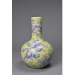 A CHINESE LIME GREEN GROUND TIANQIUPING, KANGXI MARK, 20TH CENTURY. Globular body leading into a