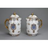 A PAIR OF LATE 20TH CENTURY CHINESE EXPORT STYLE ARMORIAL JUGS AND COVERS. Each with gilt lion dog