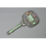 A CHINESE EXPORT SILVER HAND MIRROR, EARLY 20TH CENTURY. On a butterfly handle with jade insert with