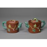 A PAIR OF VINTAGE CHINESE YIXING POTTERY TEAPOTS, 20TH CENTURY. Each with added enamelled grape vine