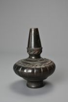 A SOUTH EAST ASIAN CARVED CERAMIC BOTTLE VASE, 20TH CENTURY, PROBABLY THAI