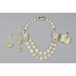 A CHINESE JADE NECKLACE AND PENDANT, EARLY 20TH CENTURY. The necklace with oval beads incised with