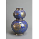 A CHINESE BLUE GROUND AND GILT DECORATED DOUBLE GOURD PORCELAIN VASE, 19/20TH CENTURY. Well