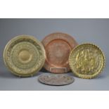 FOUR INDO-PERSIAN BRASS AND COPPER DISHES, LATE 19TH/EARLY 20TH CENTURY. Comprising: a tinned copper