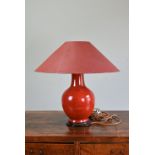 A CHINESE ORANGE GROUND PORCELAIN LAMP. The vase of baluster from covered in a reddish orange glaze.