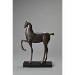 AN ART DECO STYLE BRONZE MODEL OF A HORSE, PROBABLY 20TH CENTURY. Similar to the works of Elie