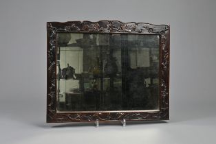 A CHINESE HARDWOOD FRAMED MIRROR, 19/20TH CENTURY. Of rectangular form carved in relief with birds