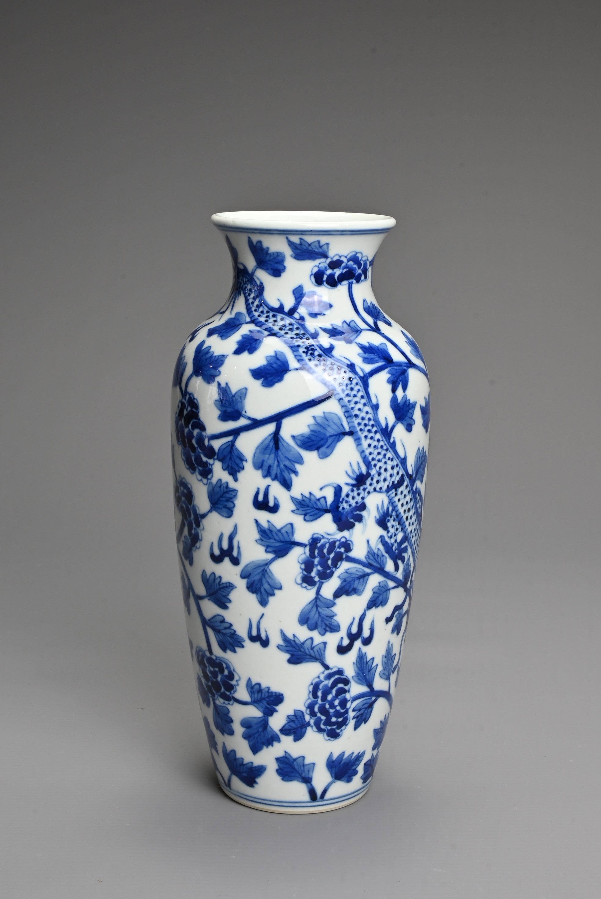 A CHINESE BLUE AND WHITE PORCELAIN VASE. Decorated with a dragon and leafy peony scrolls with flat - Image 3 of 6