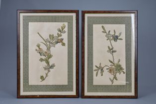 A PAIR OF LATE 19TH/EARLY 20TH CENTURY CHINESE SILK EMBROIDERED PANELS. Each with a spray of flowers