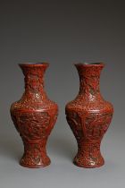 A PAIR OF CHINESE CINNABAR LACQUER VASES, QING DYNASTY. Each of baluster form carved in relief