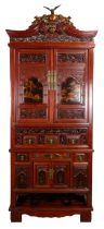 A VERY LARGE CHINESE SECTIONAL LACQUERED CABINET, 20TH CENTURY. In four tiers to include the stand