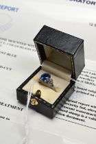 A CHOW TAI FOOK SAPPHIRE AND DIAMOND DRESS RING, WITH LAB REPORT. A round faceted mixed cut sapphire