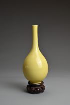 A FINE CHINESE YELLOW GLAZED PORCELAIN BOTTLE VASE, REPUBLIC PERIOD OR EARLIER. Finely potted