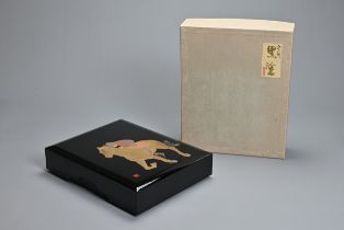 A 20TH CENTURY JAPANESE BLACK LACQUER BUNKO BOX OF HORSE RACING INTEREST. Of rectangular section,