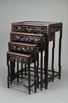 A NEST OF FOUR CHINESE HARDWOOD OCCASIONAL TABLES, EARLY 20TH CENTURY. Of rectangular form with
