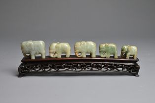 CHINESE JADE ELEPHANT GROUP ON WOODEN STAND, 19/20TH CENTURY