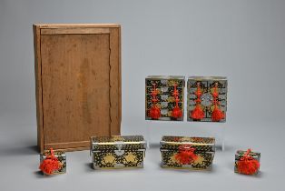 A SET OF 20TH CENTURY JAPANESE BLACK LACQUER AND WHITE METAL MOUNTED HINA DOLLS STORAGE BOXES.