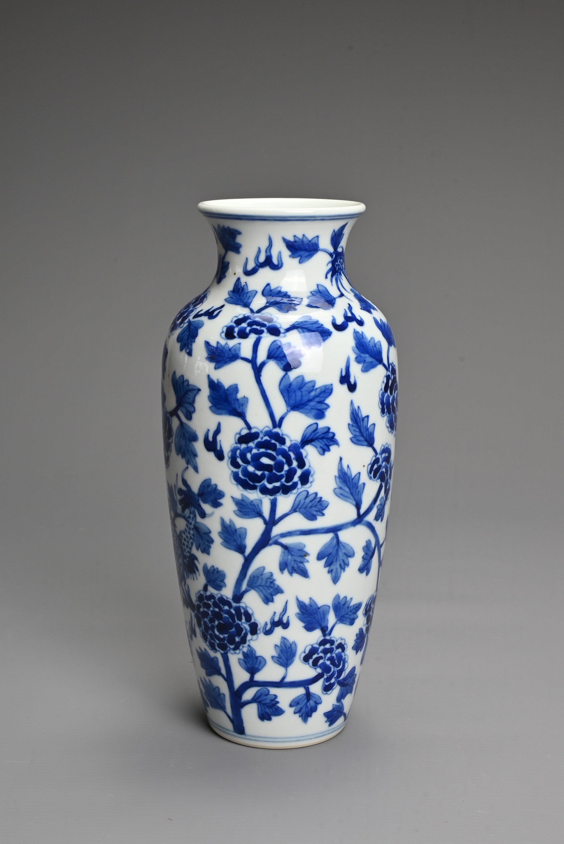 A CHINESE BLUE AND WHITE PORCELAIN VASE. Decorated with a dragon and leafy peony scrolls with flat - Image 2 of 6