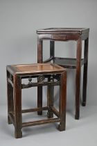 TWO CHINESE HARDWOOD STANDS, EARLY 20TH CENTURY. The larger stand with a single frieze drawer and