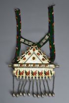 A TURKOMAN TEKKE TRIBAL SILVER AND FIRE GILDED CARNELIAN AMULET PENDANT, KUMUSCH-DOGA, 19/20TH