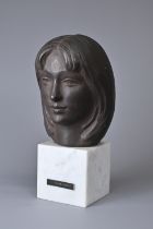 A JAPANESE BRONZE BUST OF LADY K ON A WHITE MARBLE PLINTH BASE AFTER YASUTAKE FUNAKOSHI (1912-2002).