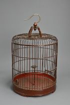 A LARGE 20TH CENTURY CHINESE RED PAINTED/LACQUERED WOOD BIRDCAGE. Of domed form, with central bobbin