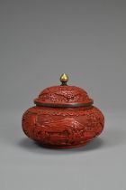 A CHINESE CINNABAR LACQUER POT AND COVER, 19TH CENTURY. Of squat form with domed cover carved in