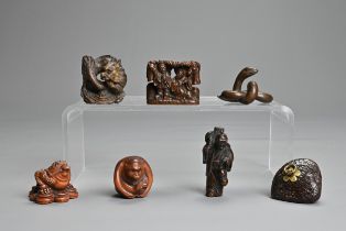 A COLLECTION OF EIGHT CHINESE AND JAPANESE CARVED WOOD NETSUKE, 19TH CENTURY AND LATER.