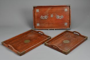 THREE CHINESE WOOD TRAYS, EARLY 20TH CENTURY. To include a rectangular tray with metal dragons and