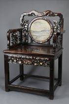A CHINESE MOTHER-OF-PEARL INLAID AND MARBLE-INSET HARDWOOD ARMCHAIR, 19TH CENTURY. With shaped top