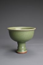 A CHINESE LONGQUAN CELADON GLAZED STEM BOWL. Heavily potted with a deep, rounded bowl carved with