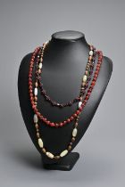 THREE BEADED NECKLACES. To include a vintage cluster beaded garnet necklace; An agate and wood