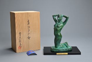 A CONTEMPORARY JAPANESE BRONZE OF A NUDE WOMAN. In verdigris patination, she cast kneeling, with her