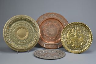 FOUR INDO-PERSIAN BRASS AND COPPER DISHES, LATE 19TH/EARLY 20TH CENTURY. Comprising: a tinned copper