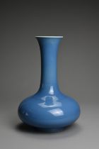 A CHINESE BLUE GLAZED PORCELAIN VASE, 20TH CENTURY. Squat bulbous body with tall tapered cylindrical