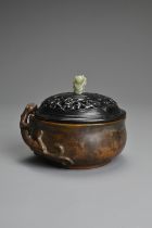 A CHINESE BRONZE CENSER. Heavily cast of rounded form with figure of chilong and two character