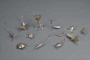 A SET OF TWELVE INDIAN WHITE METAL INSECT AND REPTILE MENU HOLDERS, EARLY 20TH CENTURY. Each