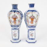 A pair of blue and white and famille rose baluster decorated with urns of spring flowers , Qianlong