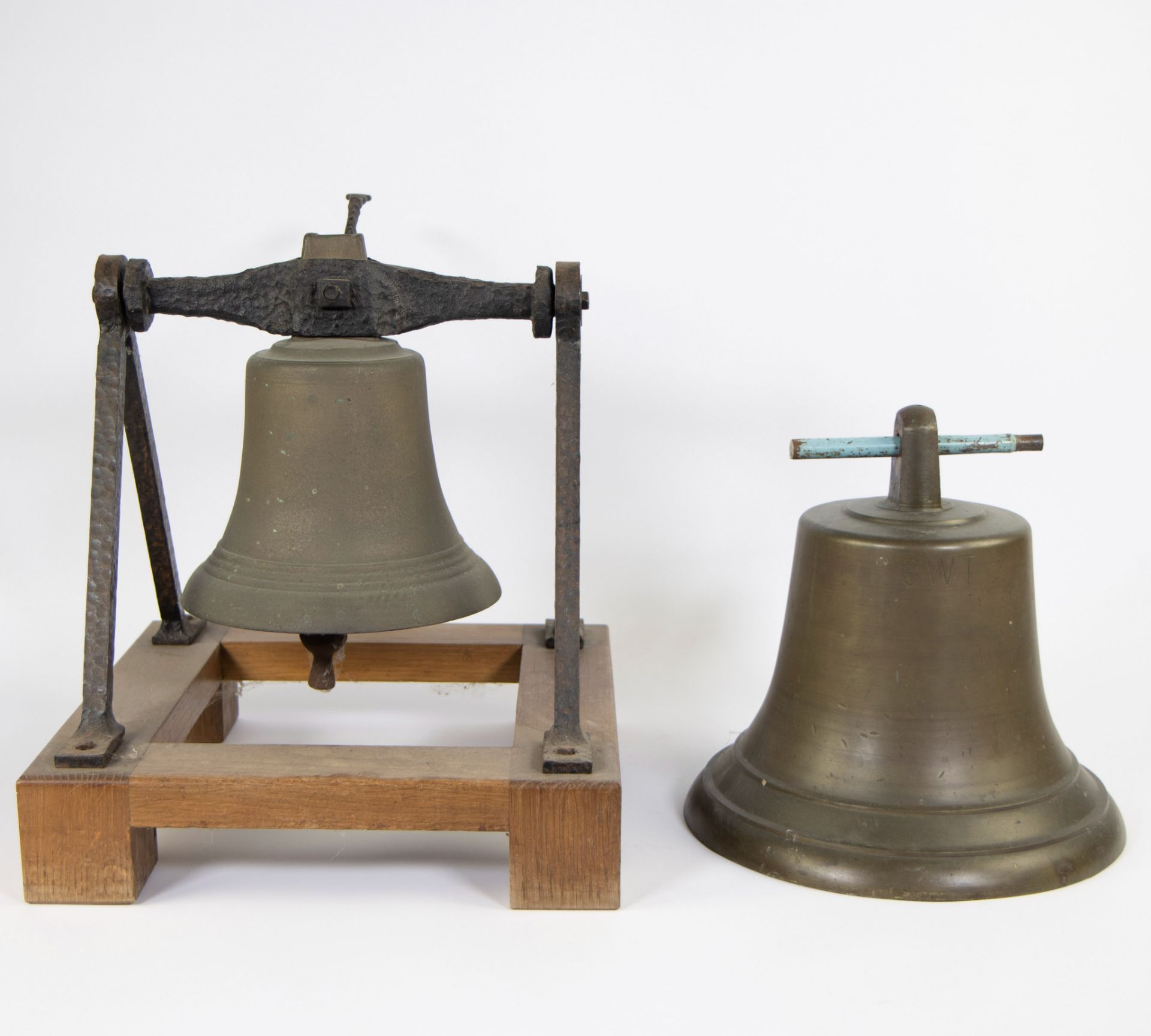 Lot of 2 bronze bells, one on a wooden frame