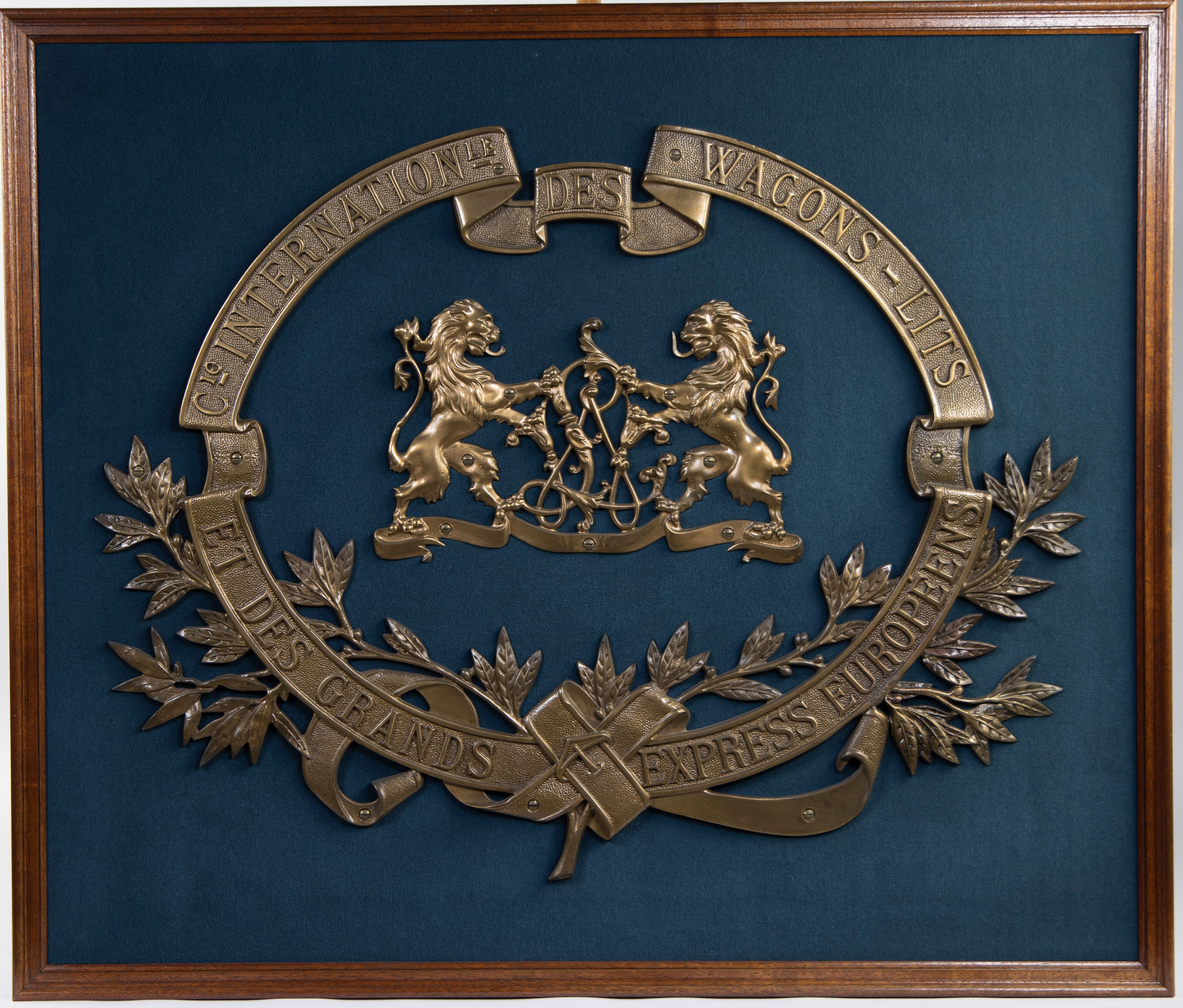 Frame with large bronze emblem of Cie Internationale des WAGON LITS et des grand express Européens.