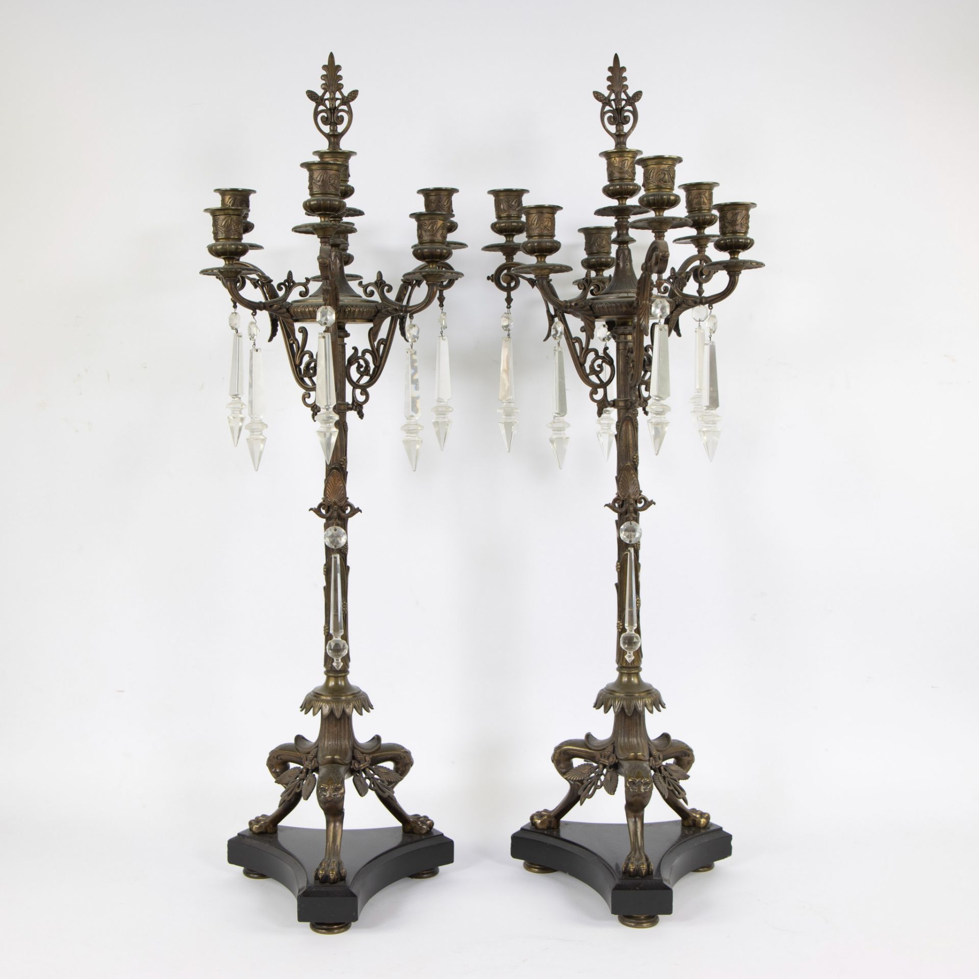 Two large rare solid bronze 19th century candlesticks with 7 light points, standing on claw feet and